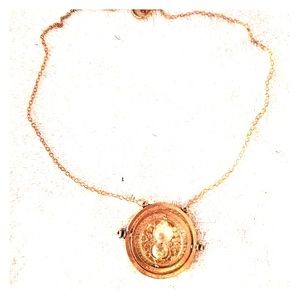 Gold tone hour glass necklace